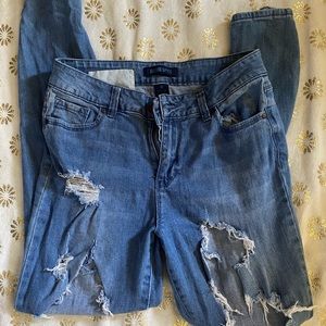 Blue spice distressed skinny jeans